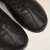Zapatillas deportivas de piel de vaca negra Zapatillas deportivas de piel de vaca negra